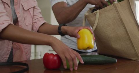 Hands of Couple Unpacking Fresh Groceries on Kitchen Counter - Download Free Stock Images Pikwizard.com