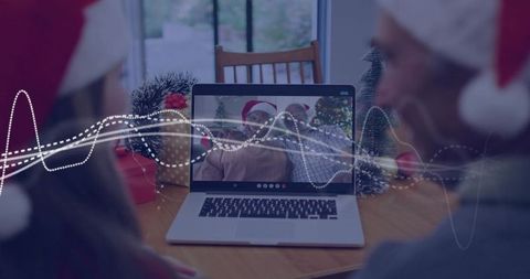 Multigenerational Family Video Calling During Holiday with Santa Hats and Cozy Decor