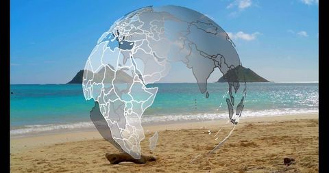 Transparent globe overlay rising on tropical beach horizon with sparkling turquoise waves