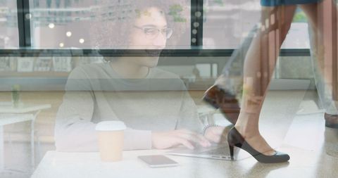 Woman Using Laptop in Cafe with Busy Workspace Overlays