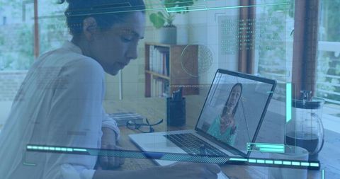 Mature woman working remotely, writing notes during video call with futuristic hud overlay