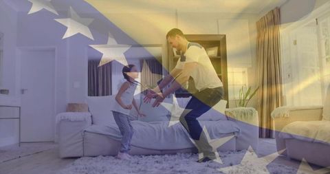 Father playing with daughter on sofa with american flag overlay, cozy home bonding