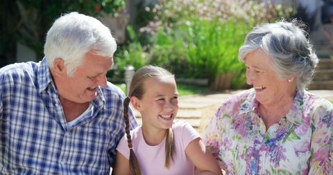 Happy Grandparents Enjoying Time with Granddaughter Outdoors - Download Free Stock Images Pikwizard.com