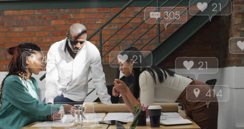 Diverse Team Collaborating with Social Media Overlay in Office