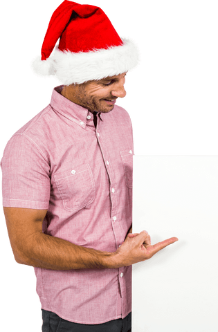 Man in santa hat pointing at transparent sign isolated