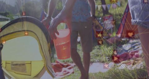Technological Overlays at Outdoor Gathering with Beverage Details