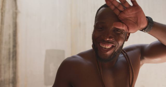 Smiling Man Wiping Sweat from Forehead in Summer Heat - Download Free Stock Images Pikwizard.com