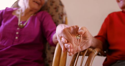 Elderly Couple Holding Hands in Relaxation Moment
