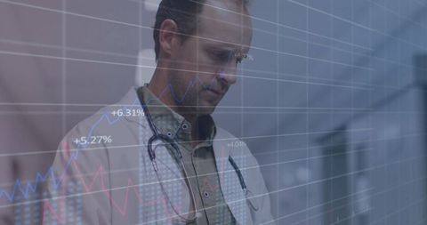 Medical Professional Analyzing Digital Data in Hospital Corridor