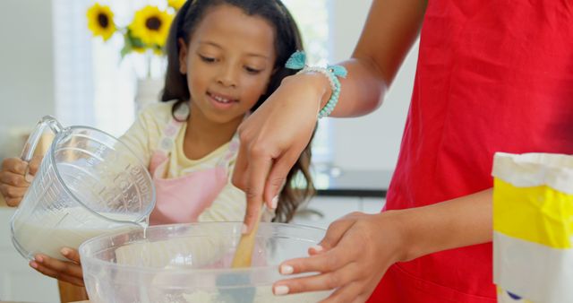 Mother and Daughter Enjoying Baking Activity Together in Kitchen - Download Free Stock Images Pikwizard.com