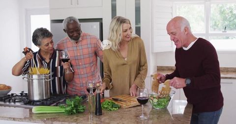 Group of Friends Preparing Meal Together in Bright Kitchen
