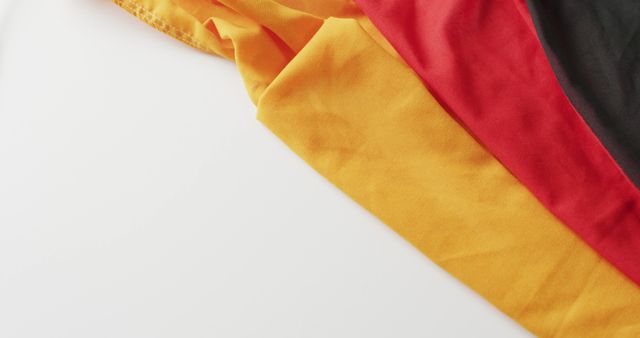 Image of creased flag of germany lying on white background. nationality, state symbols, patriotism and independence concept.
