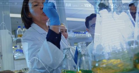 Scientists conducting laboratory experiment with digital data overlay and analytics