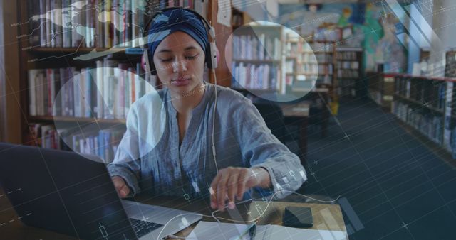 Focused Woman Analyzing Data on Laptop in Library - Download Free Stock Images Pikwizard.com