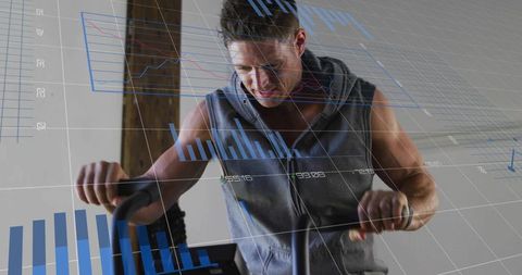 Man pedaling stationary bike with fitness data overlays in home gym