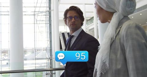 Business People Conversing in Corporate Environment with Notifications