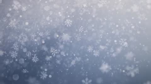Soft Falling Snowflakes Drifting Over Bluish Gray Winter Bokeh Background