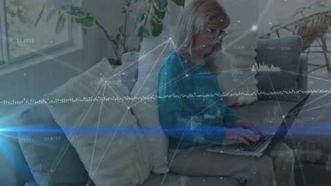 Senior Woman Engaging with Data Analytics on Laptop at Home