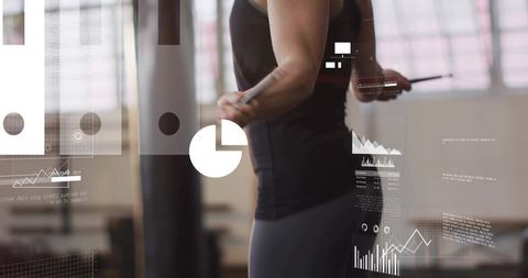 Mid-adult woman tracking fitness metrics on tablet with augmented data overlays in gym