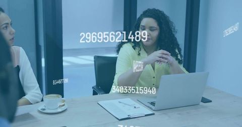 Businesswoman Analyzing Data in Modern Glass Office