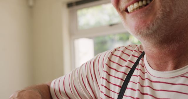 Senior Man Smiling Wearing Striped Shirt at Home - Download Free Stock Images Pikwizard.com