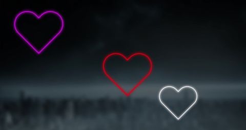 Glowing Neon Hearts on Dark Background for Romantic Themes