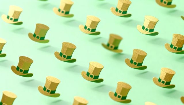 Gold glitter top hat pattern on mint green backdrop for festive st patrick's day design