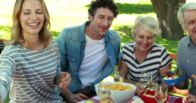 Family Enjoying Outdoor Picnic with Snacks and Drinks - Download Free Stock Images Pikwizard.com