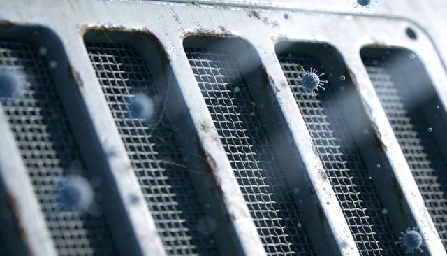 Rusted hvac vent grille showing floating virus particles mesh grid macro ai-generated