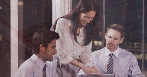 Confident business team analyzing financial data on tablet