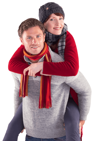 Happy Couple Piggyback Ride Wearing Winter Clothing on Transparent Background