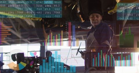 Female Auto Technician Inspecting Vehicle Underbody with Augmented Reality Diagnostics