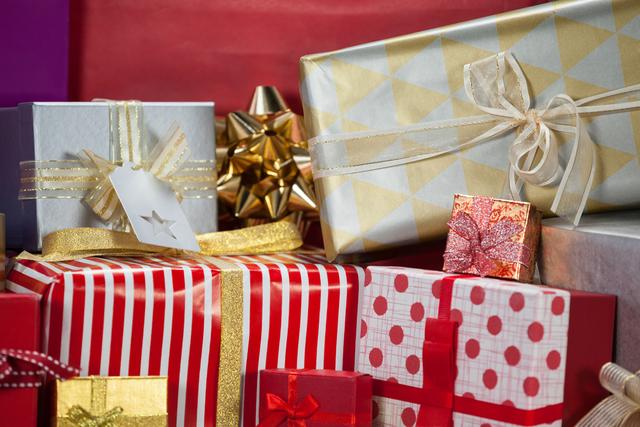 This image showcases a variety of beautifully wrapped gift boxes, perfect for holiday and Christmas-themed projects. It can be used for holiday marketing materials, festive greeting cards, social media posts, and advertisements promoting Christmas sales and gift ideas.