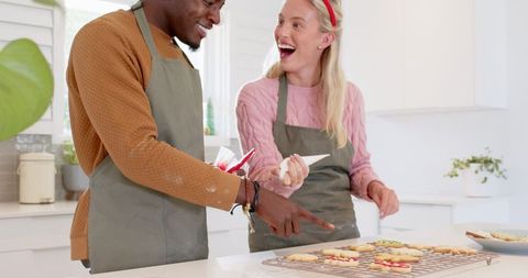 Diverse Friends Decorating Homemade Sugar Cookies Together