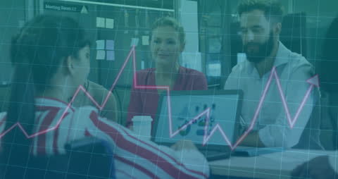 Diverse Colleagues Discussing Work Over Financial Data Visualization