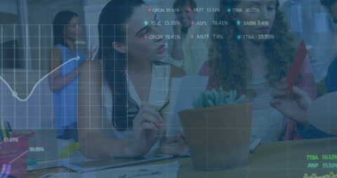 Diverse Business Team Analyzing Digital Financial Data Overlays