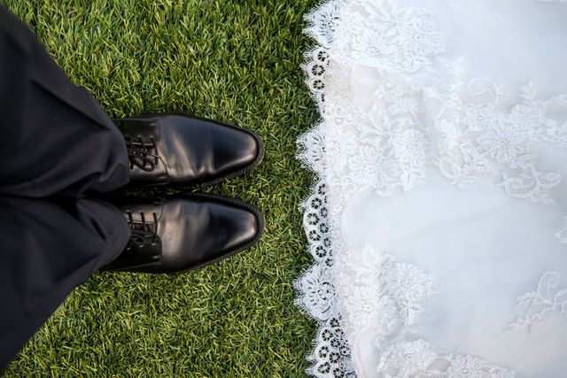 Bride and Groom Feet on Grass with Wedding Dress Lace - Download Free Stock Photos Pikwizard.com