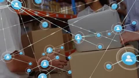 Warehouse Team Using Technology for Efficient Inventory Management