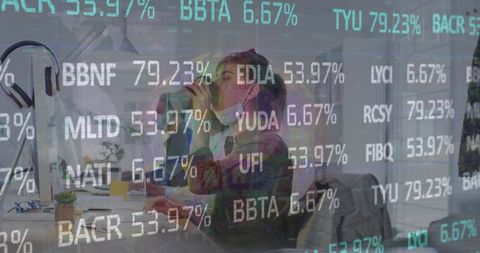 Masked Office Workers Analyzing Financial Data Overlaid on Screen