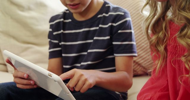 Children Playing with Tablet on Couch - Download Free Stock Images Pikwizard.com