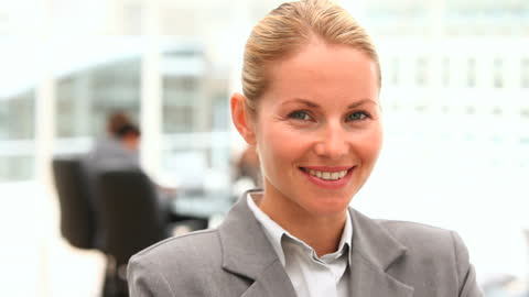 Successful Businesswoman Smiling in Office Environment