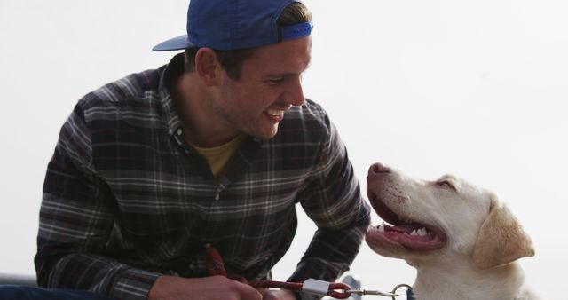 Man Enjoying Day with Labrador Retriever Outdoors - Download Free Stock Images Pikwizard.com