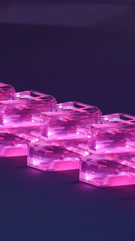 Vertical video glinting pink hexagonal crystals reflecting neon light on purple plane