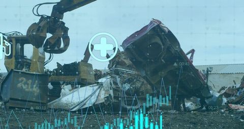 Excavator grapple lifting crushed car bodies at salvage yard with hud overlay
