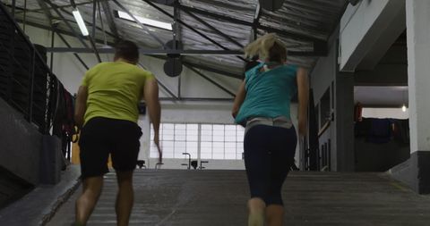 Couple Jogging in Urban Indoor Parking Garage