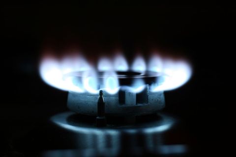 Close-up of Glowing Blue Gas Stove Flames in Kitchen