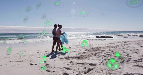 Volunteers cleaning beach with floating eco icons