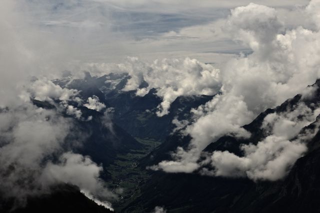 Dramatic Mountain Landscape Through Clouds - Download Free Stock Photos Pikwizard.com
