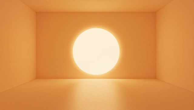Glowing circular light flooding minimalist orange room casting warm reflection