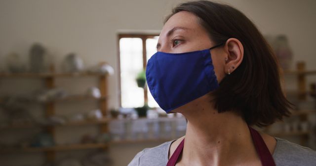 Woman Wearing Face Mask in Pottery Workshop - Download Free Stock Images Pikwizard.com